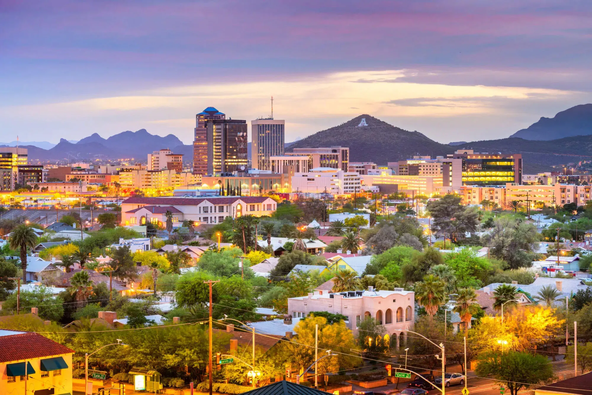 Downtown Tucson skyline at dusk with Sentinel Peak and the surrounding mountains